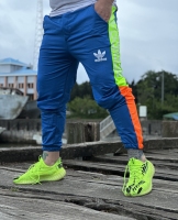 شلوار اسلش adidas آبی بغل نوار فسفری نارنجی
